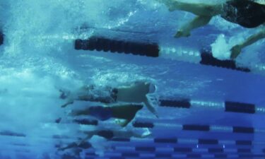 Swimmers compete in the pool during the Pro Swim Series event in Sacramento