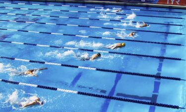 Swimmers compete in the pool during the Pro Swim Series event in Sacramento