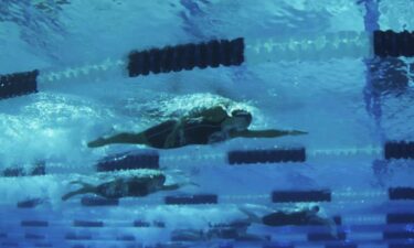 Swimmers compete in the pool during the Pro Swim Series event in Sacramento