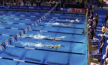 Swimmers compete in the pool during the Pro Swim Series event in Sacramento