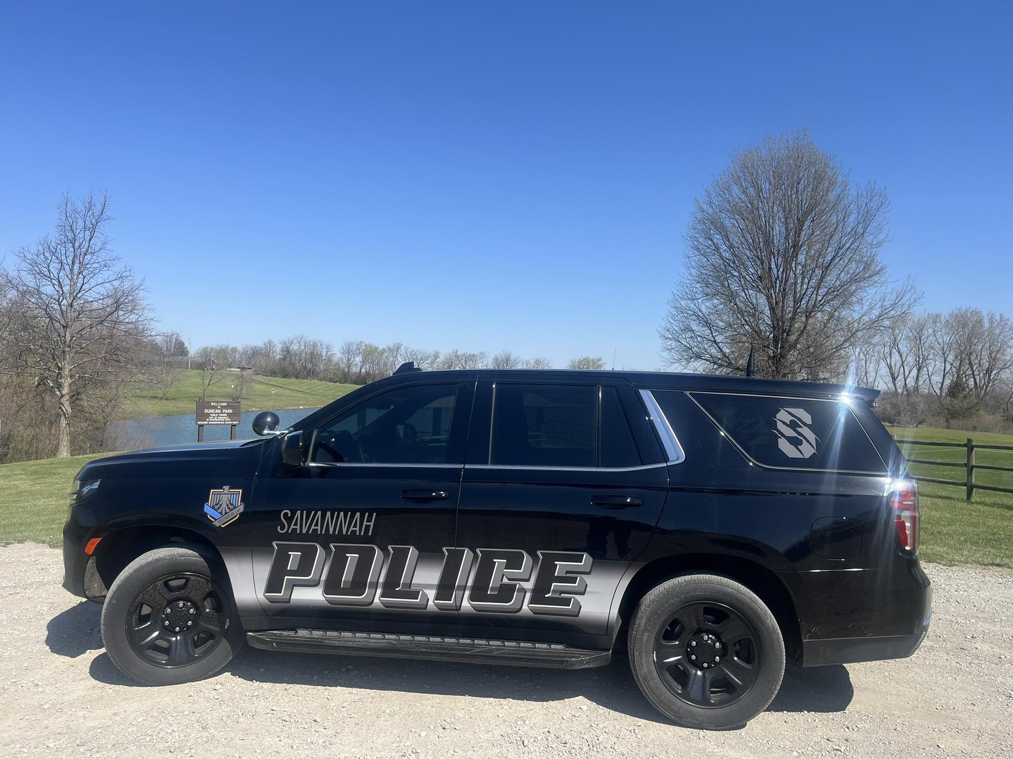 A Savannah Police Department vehicle sits in a lot in Duncan Park. 