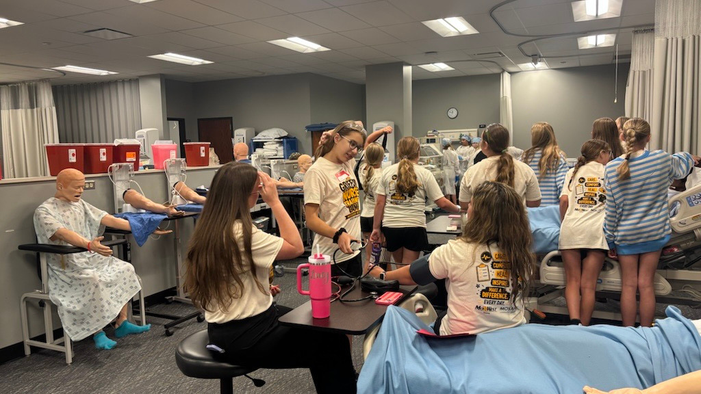 Participants at MoWest's summer Nursing Camp explore interactive set ups.