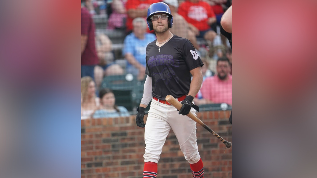 Brady Holden walks up to bat during a St. Joseph Mustangs game. 