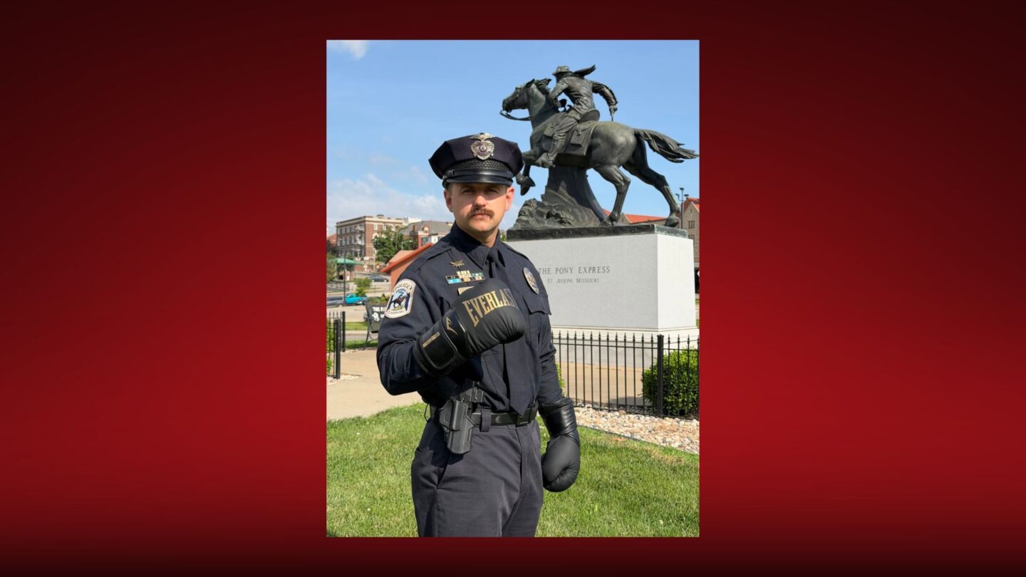 SJPD Office Lucas Winder stands in front of the Pony Express statue Downtown.