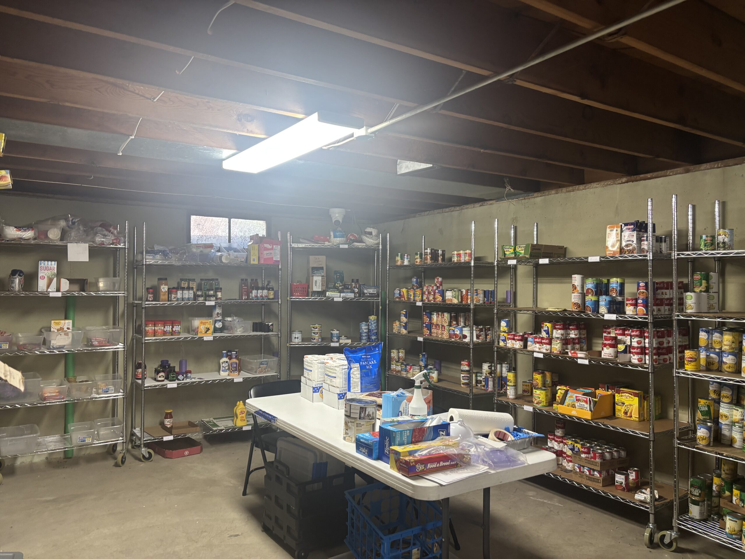 Non-perishable foods sit on shelves at Pivotal Point Transitional Housing's pantry. 
