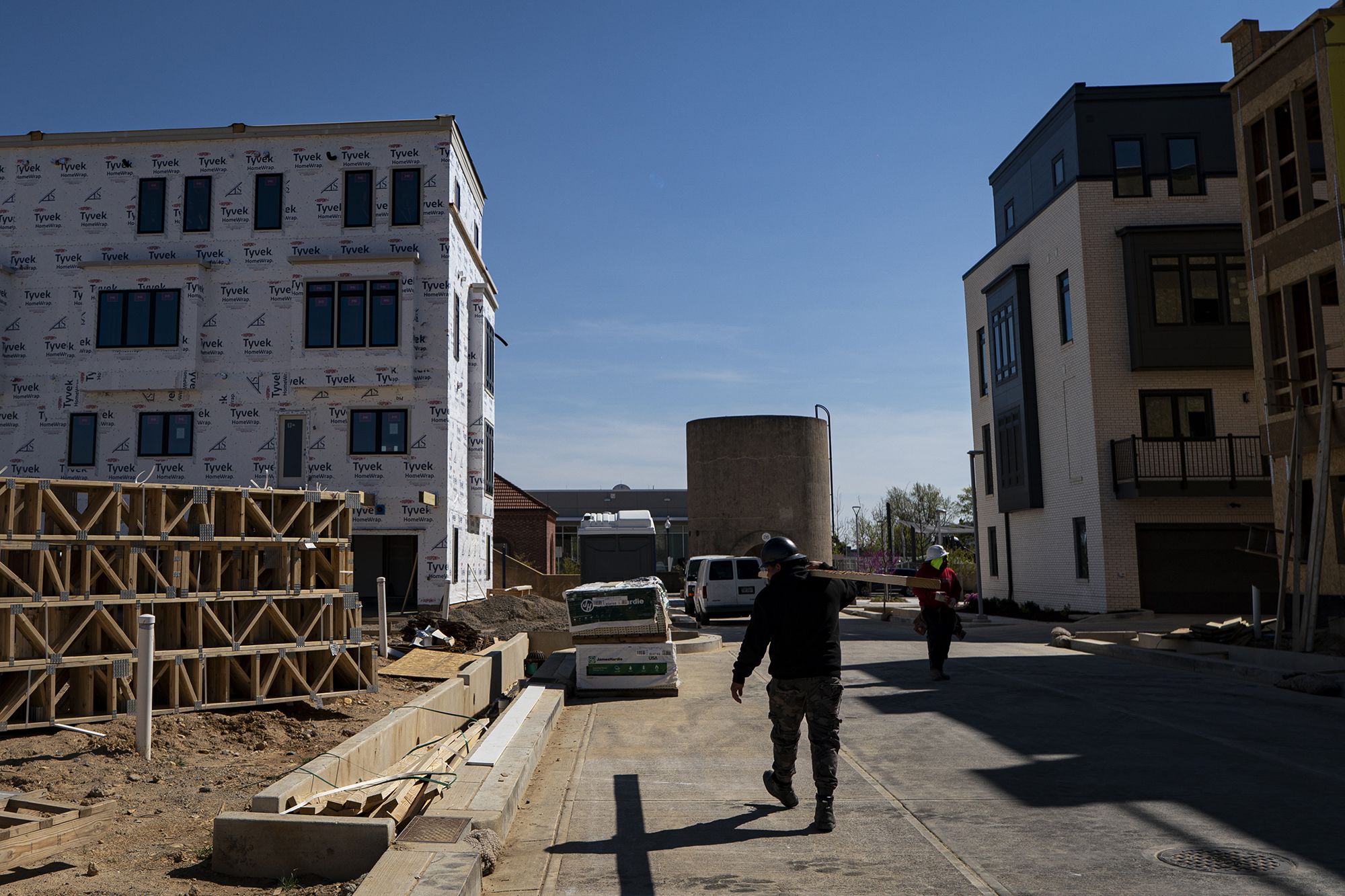 New townhouses stand near the Reservoir Park Recreation Center on April 8 in Washington, DC. US businesses are brushing off those “Now Hiring” signs: Job postings rose sharply in April to their highest level in nearly two years, Bureau of Labor Statistics data showed on June 2.
