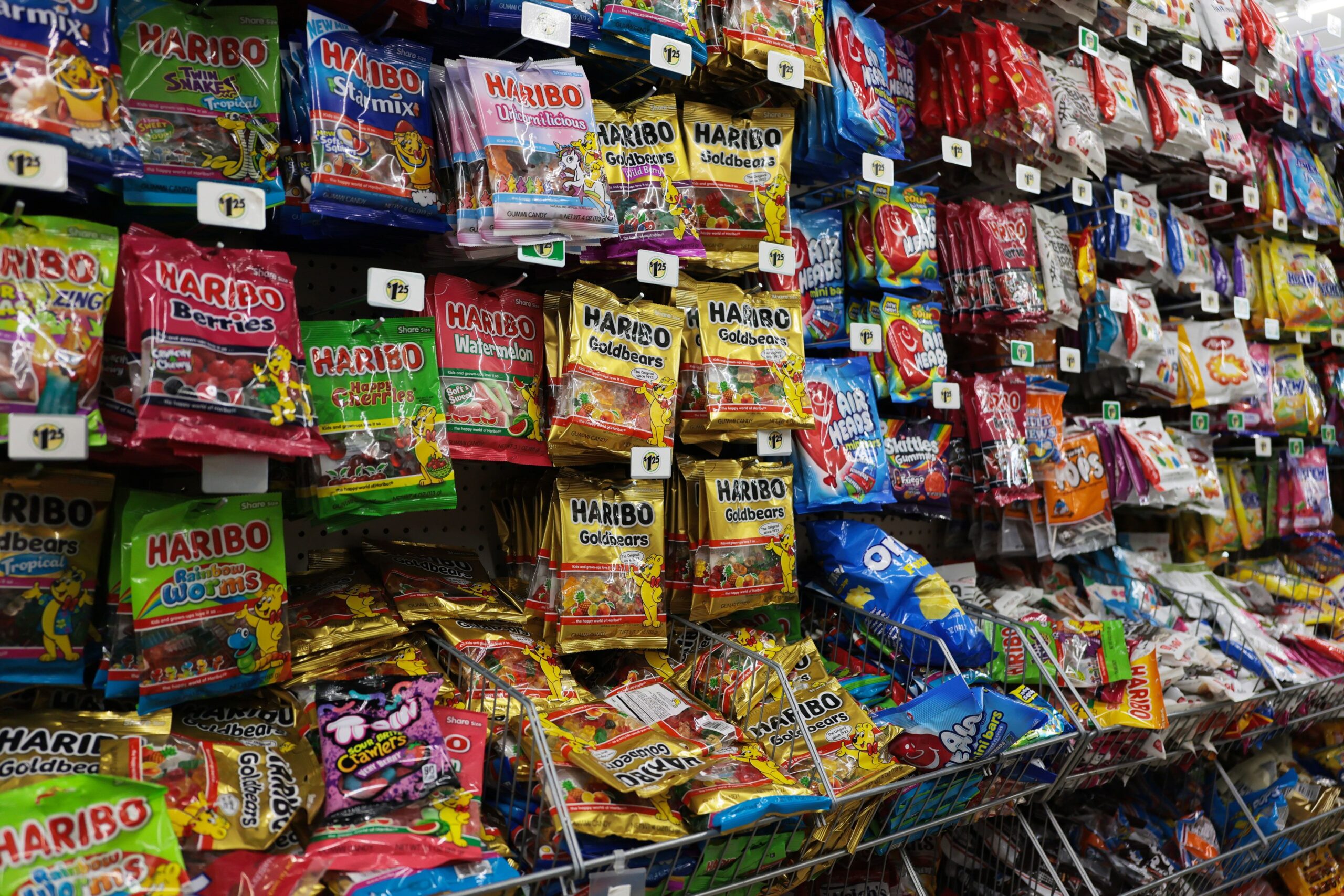 Bags of candy are displayed on a store's shelves on April 21, in Miami. A federal judge on June 22 blocked the Trump administration from allowing five states to ban the purchase of sugary drinks and candy with food stamps.