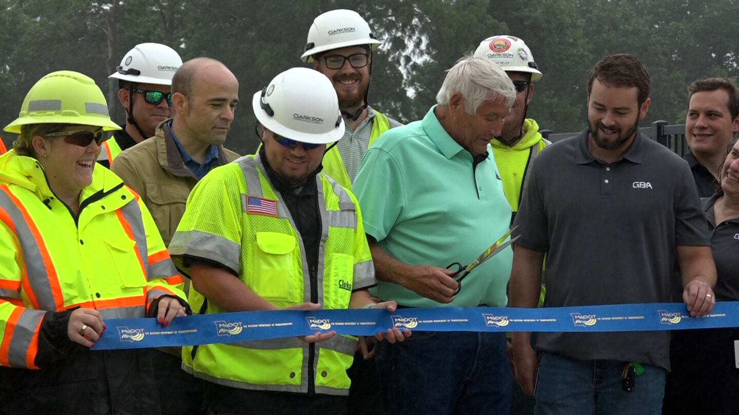 Mayor Larry Miller gathered with MoDOT for ribbon cutting.
