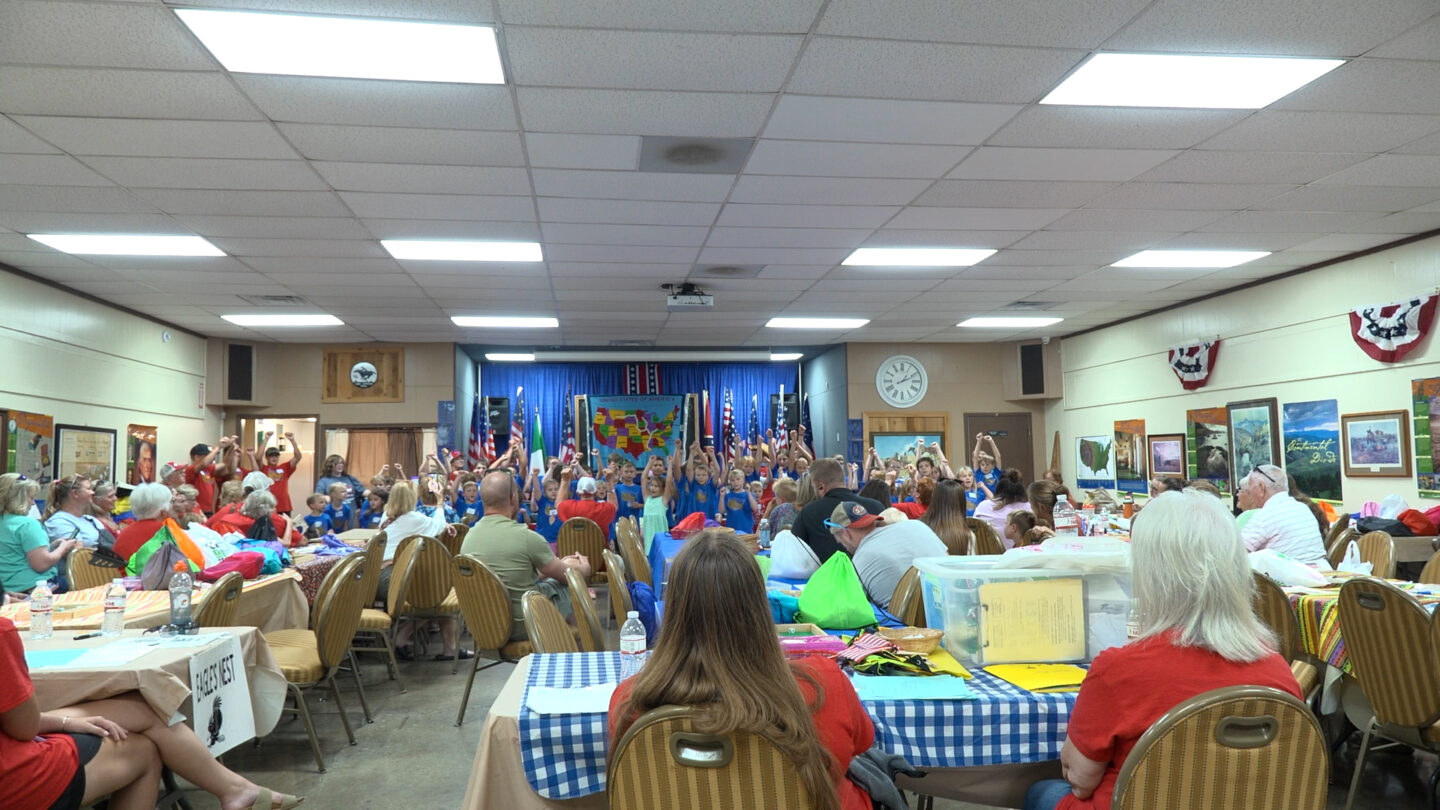 Campers performing songs they learned during the day camp.