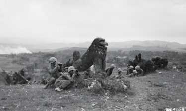 A World War II-era textbook on display at the Okinawa Prefectural Archives uses military images to teach elementary school students how to count.