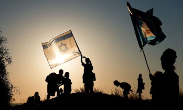 Pro-settlement Israelis march with flags towards the Gaza border in southern Israel on Sunday.