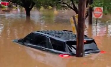 A car is seen in a sinkhole in Fayetteville