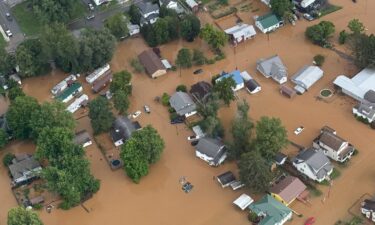 A vehicle sits in floodwater on July 17