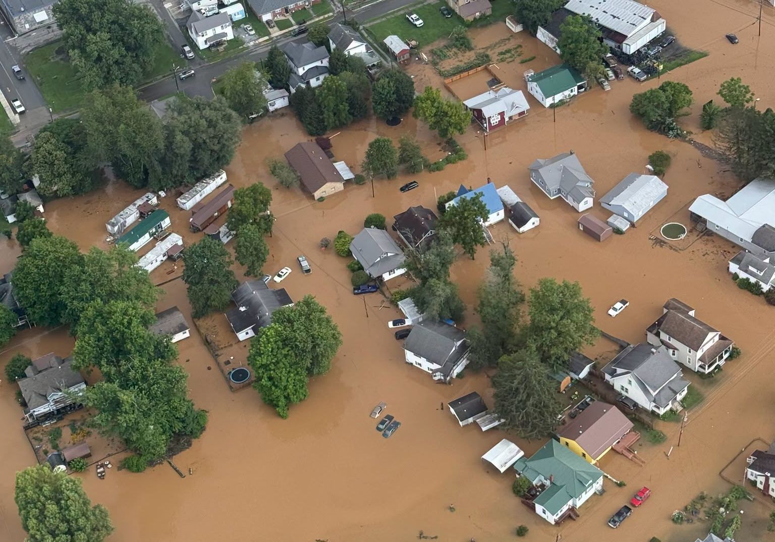 <i>Brandon Bell/Getty Images via CNN Newsource</i><br/>A vehicle sits in floodwater on July 17