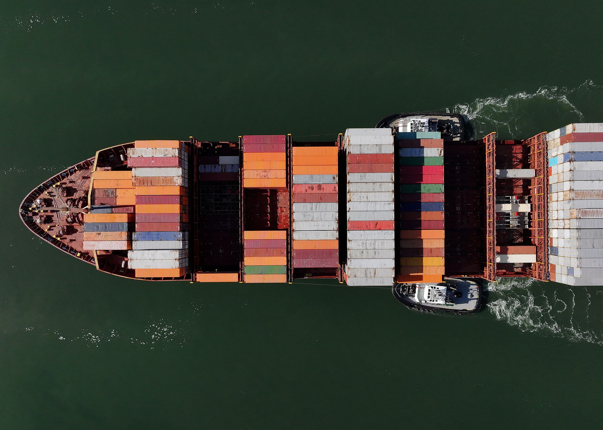 <i>Justin Sullivan/Getty Images via CNN Newsource</i><br/>A container ship arrives at the Port of Oakland on August 1