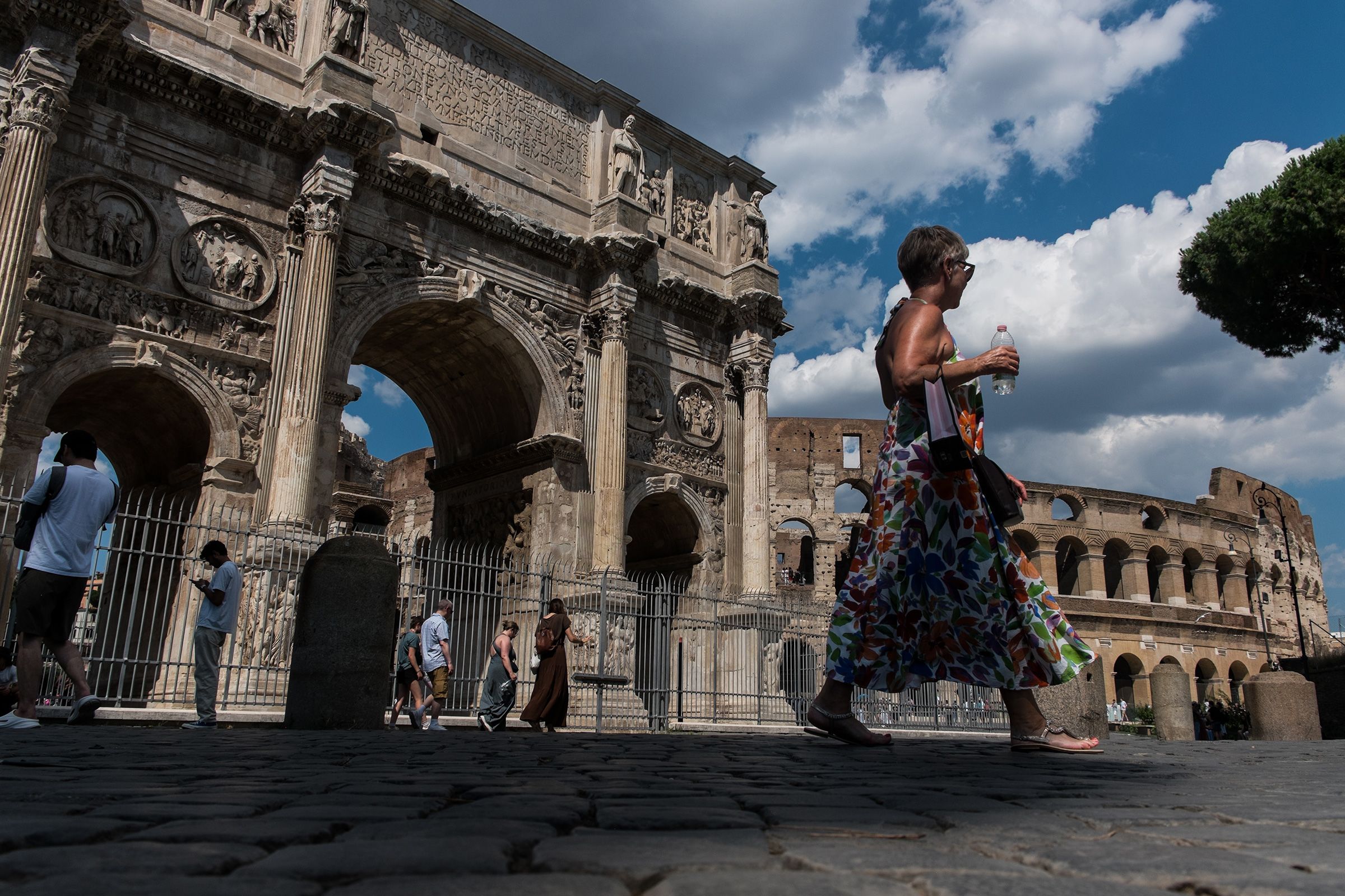 <i>Andrea Ronchini/NurPhoto/Getty Images via CNN Newsource</i><br/>People walk by the Colosseum in Rome