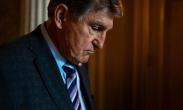 Sen. Joe Manchin enters a caucus lunch on Capitol Hill
