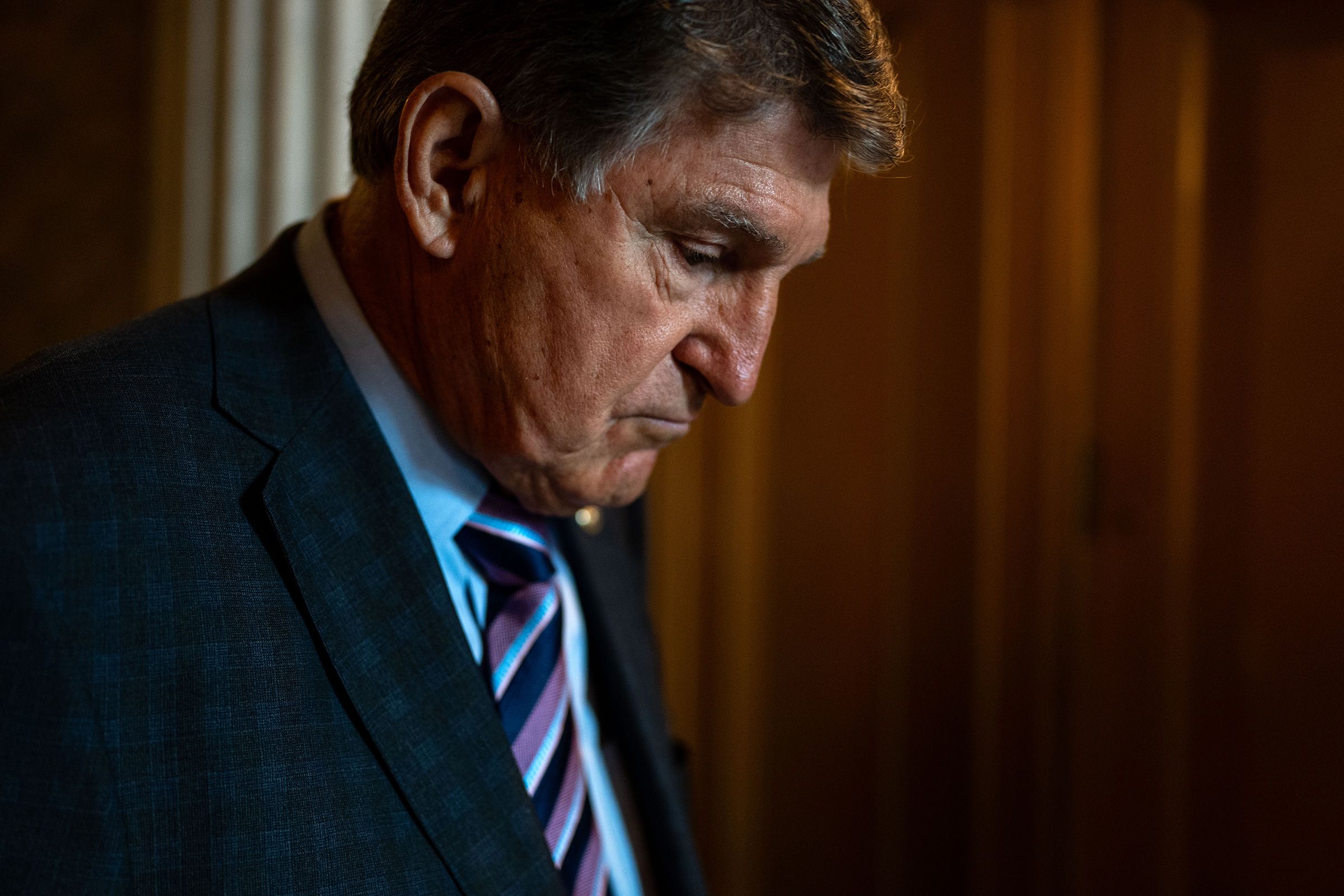 <i>Kevin Mohatt/Reuters/File via CNN Newsource</i><br/>Sen. Joe Manchin enters a caucus lunch on Capitol Hill