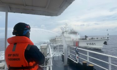 Personnel from the Philippine Navy and China Coast Guard clash near a grounded Philippine warship at Second Thomas Shoal in the South China Sea on July 20