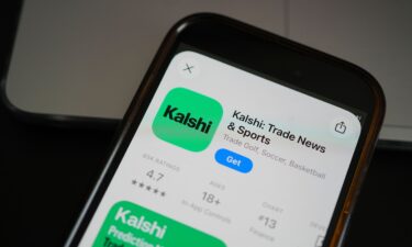 An ad for the prediction market app Kalshi is displayed on a mobile phone in Chicago