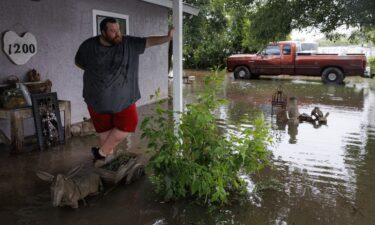 Flooding blocks off G Street along the Guadalupe River on Thursday in Kerrville
