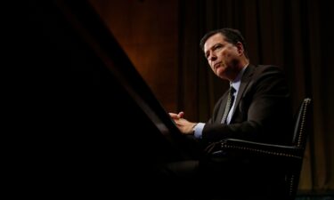 FBI Director James Comey pauses as he testifies on Capitol Hill in Washington