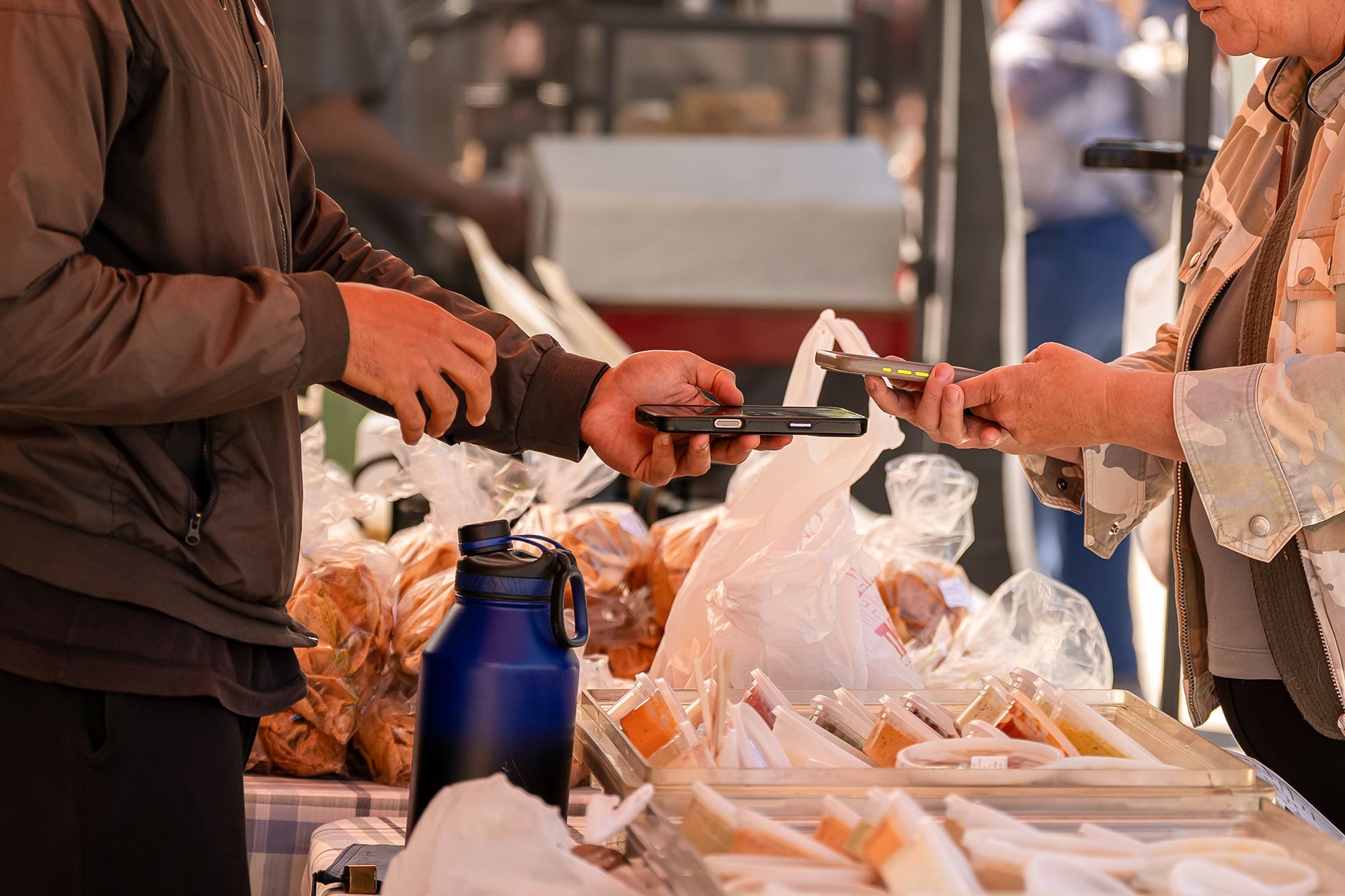 <i>David Paul Morris/Bloomberg/Getty Images via CNN Newsource</i><br/>A shopper uses a smartphone to pay for produce during a farmers market at the Ferry Building in San Francisco on July 16.