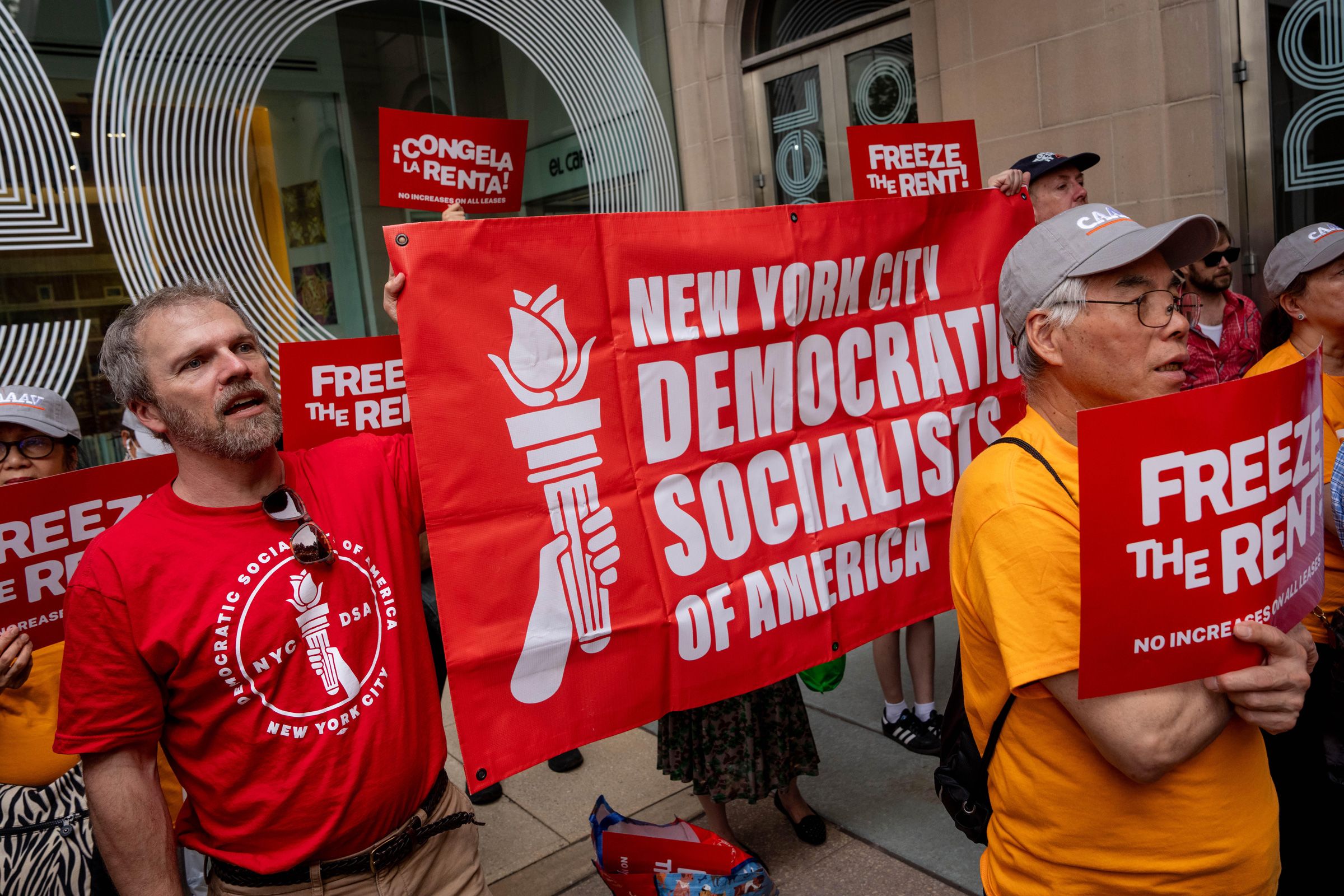 <i>Adam Gray/Bloomberg/Getty Images via CNN Newsource</i><br/>Demonstrators hold a 