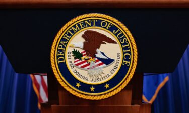 The seal of the US Department of Justice is displayed on a podium at the Department of Justice headquarters in Washington