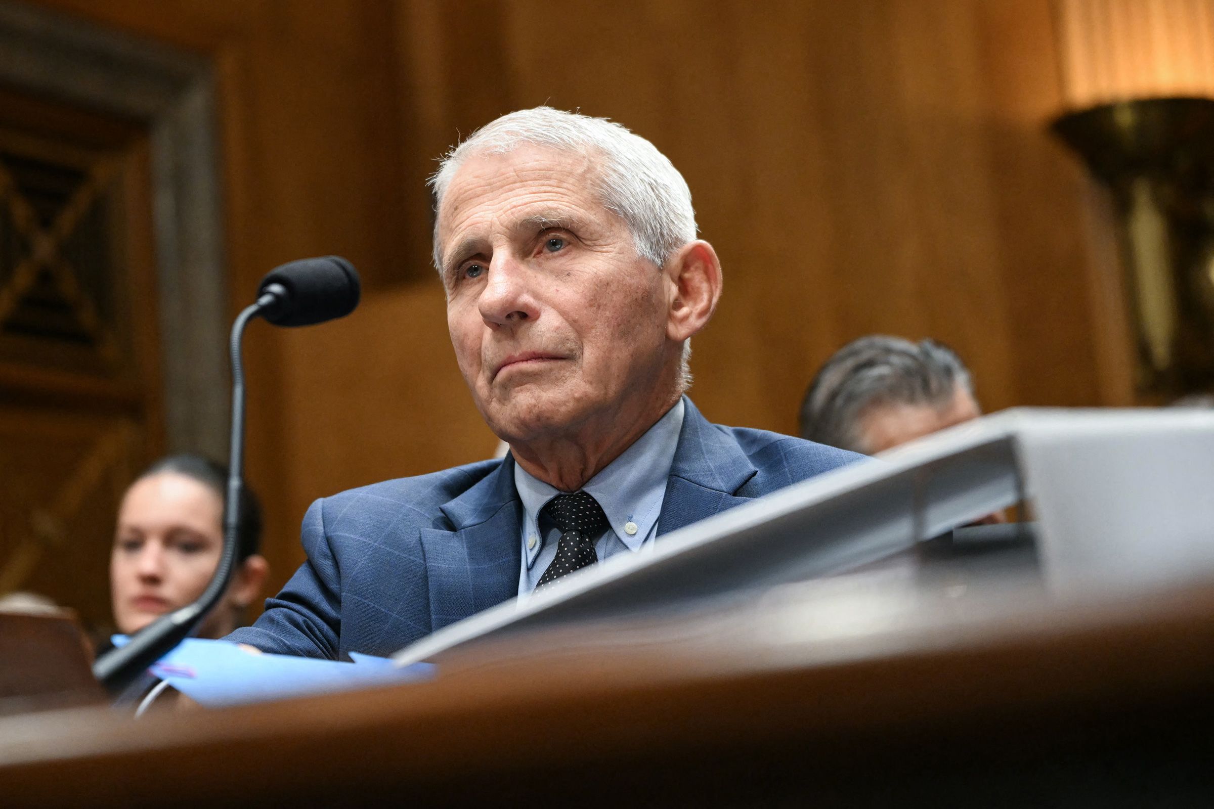 <i>Kevin Dietsch/Getty Images via CNN Newsource</i><br/>Sen. Ron Johnson speaks to Committee Chairman Sen. Rand Paul during the July 29 hearing.