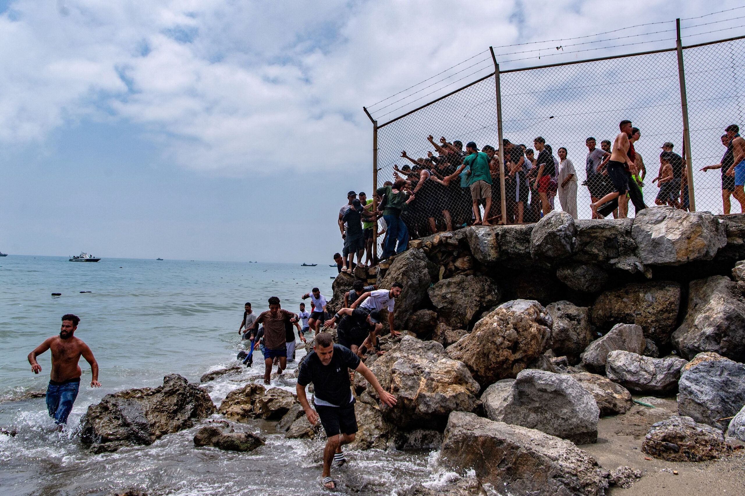 <i>Reduan Dris/EPA/Shutterstock via CNN Newsource</i><br/>Migrants reach Spanish territory after swimming from Morocco to Ceuta