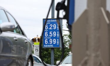 A sign displays the price of unleaded gasoline at an Exxon gas station in Washington