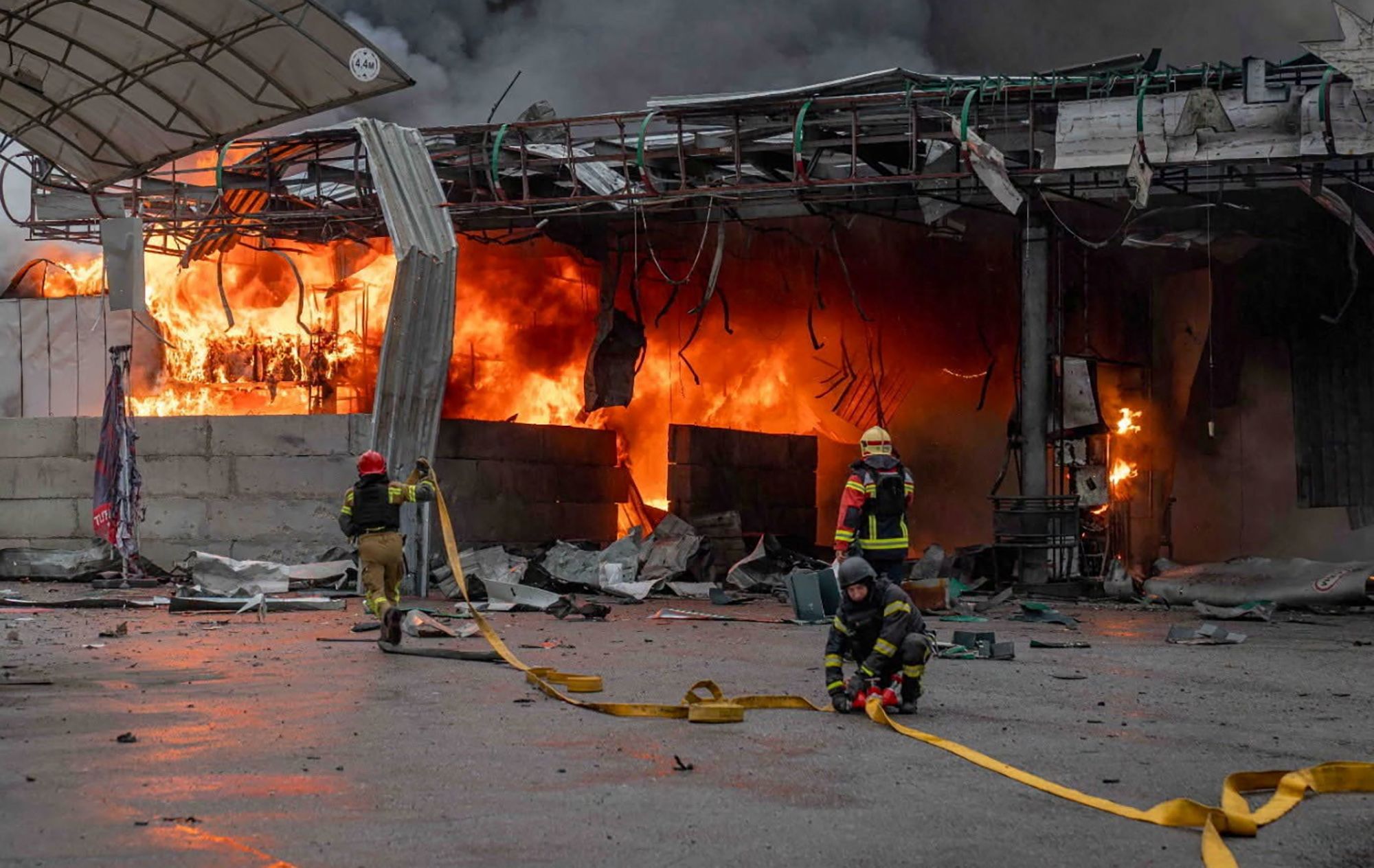 <i>State Emergency Service of Ukraine/Reuters via CNN Newsource</i><br/>Rescuers work at the site of a Russian drone strike at a gas station in Sumy