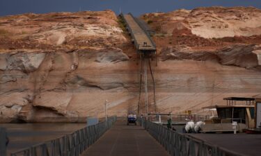 A person stands at an overlook near Lake Powell's Wahweap Marina on July 14.