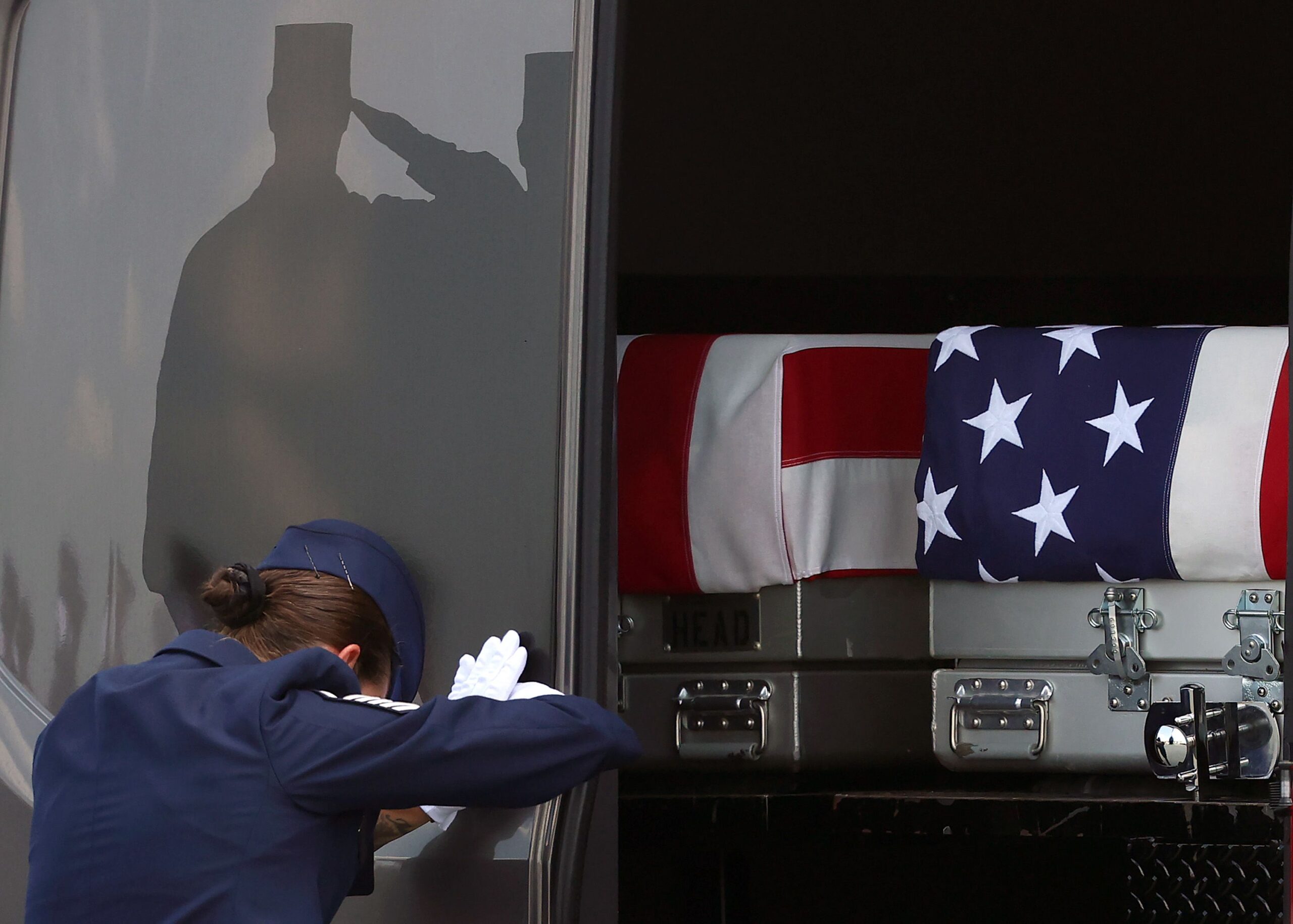 <i>Kevin Dietsch/Getty Images via CNN Newsource</i><br/>A door marshaller closes the door as the transfer cases containing the remains of U.S. Army 1st Lt Tyler Feehan and U.S. Army Staff Sgt. Michael Emmanuel Swinton arrive at Dover Air Force Base during a dignified transfer for military casualties of the war with Iran on July 22.