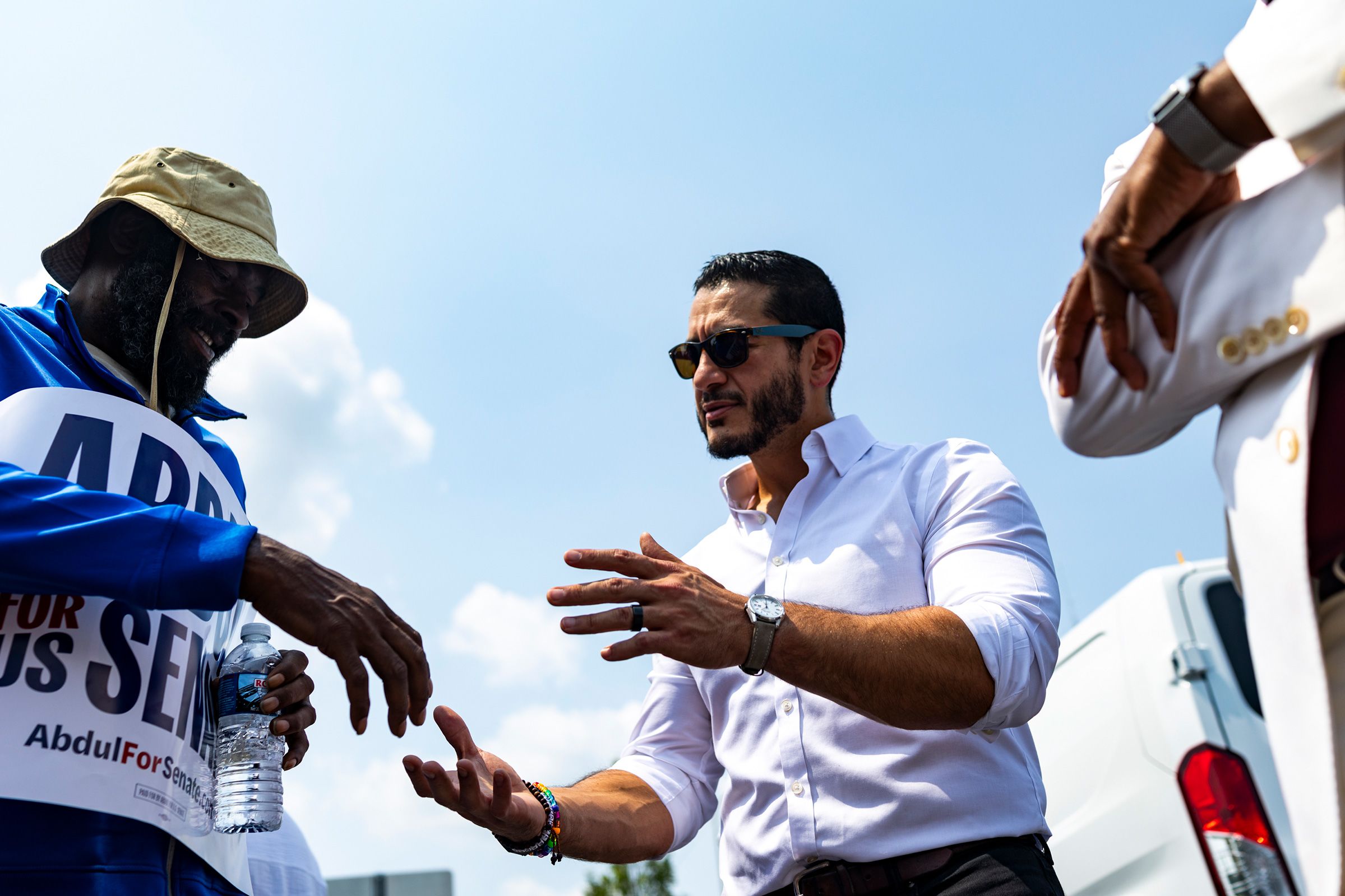 <i>Emily Elconin for CNN via CNN Newsource</i><br/>El-Sayed holds hands with church-goers during a closing prayer at New Bethel Missionary Baptist Church.