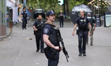 Police respond to a shooting at Seattle Center during the Bite of Seattle food festival in Seattle on Sunday.