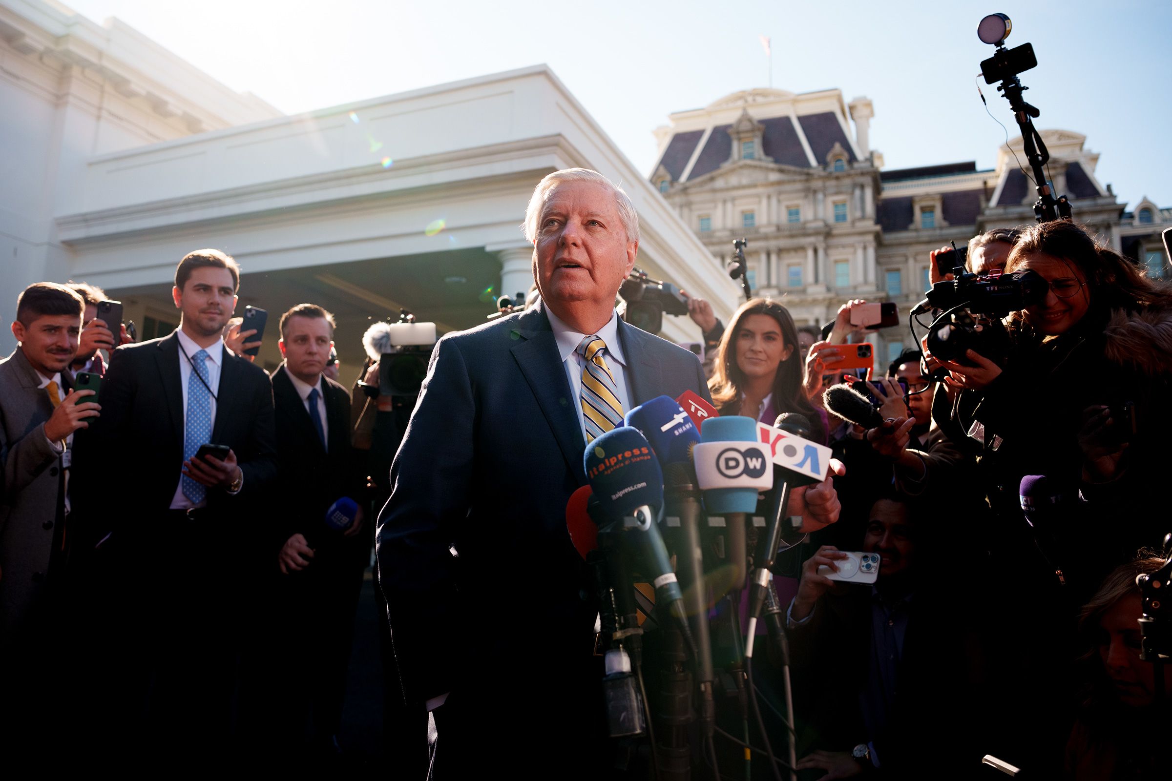 <i>Patrick T. Fallon/Bloomberg/Getty Images via CNN Newsource</i><br/>Sen. Lindsey Graham stands on stage at the start of a Republican presidential primary debate in Las Vegas
