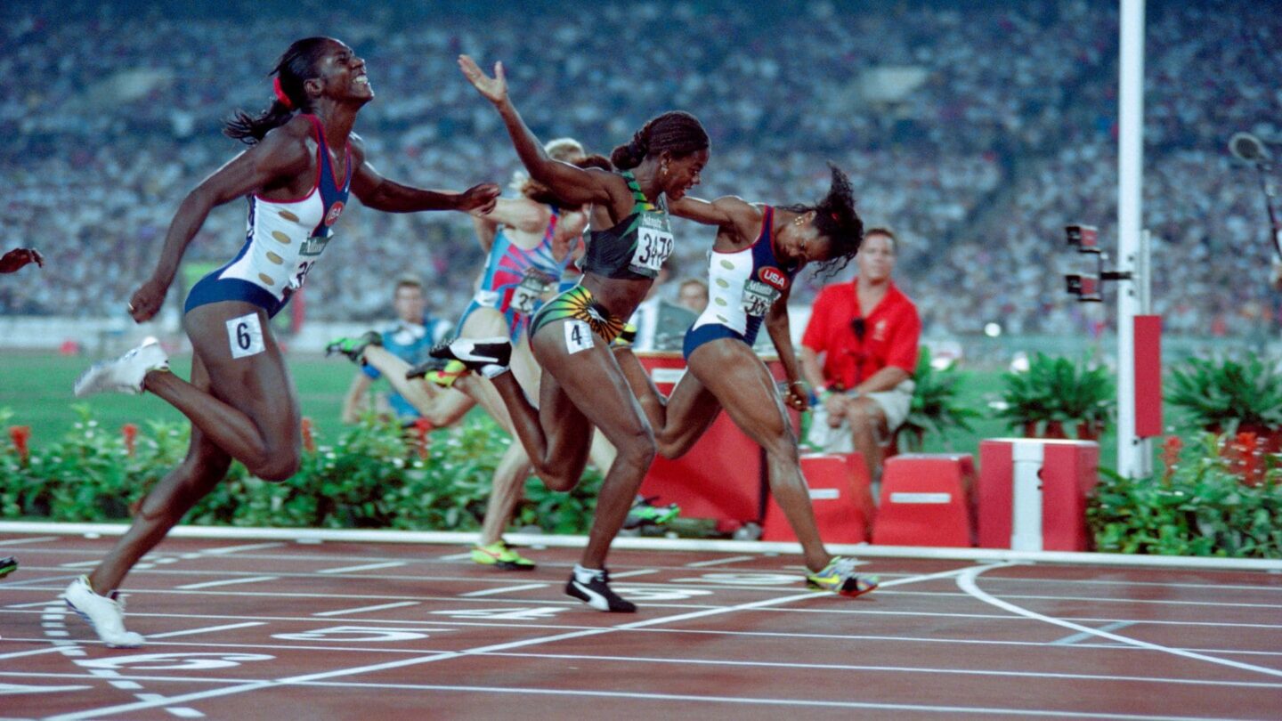 <i>NBC Olympics</i><br/>Gail Devers crosses the line and wins the women's 100m in a photo finish at the 1996 Atlanta Summer Olympics.