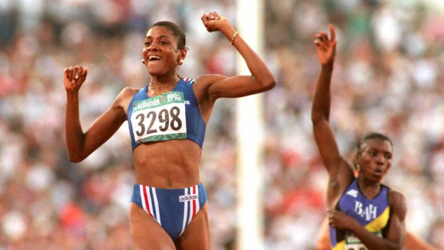 <i>NBC Olympics</i><br/>Marie-Jose Perec celebrates on the track after crossing the line during the 1996 Atlanta Summer Olympics.