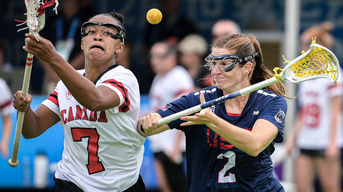 Brooklyn Walker-Welch L of Canada competes with Sam Apuzzo of the United States during the women's Gold Medal Game between Canada and the United States of Lacrosse event at The World Games 2025 in Chengdu