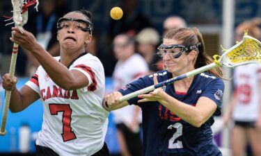 Brooklyn Walker-Welch L of Canada competes with Sam Apuzzo of the United States during the women's Gold Medal Game between Canada and the United States of Lacrosse event at The World Games 2025 in Chengdu
