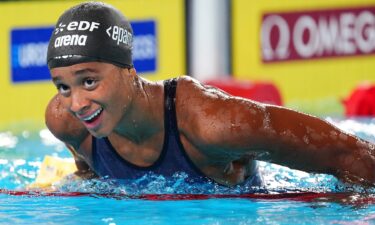 Italy's Sara Curtis reacts after setting a new world record in a semi-final of the women's 50m backstroke swimming event during the LEN European Aquatics Championships at the Olympic Aquatic Centre in Saint-Denis