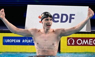 Germany's Johannes Liebmann celebrates after winning and breaking the World record in the  final of the men's 1500m freestyle swimming event during the LEN European Aquatics Championships at the Olympic Aquatic Centre in Saint-Denis