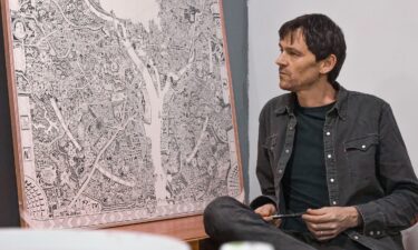 Gareth Fuller sits in front of his DC work-in-progress.