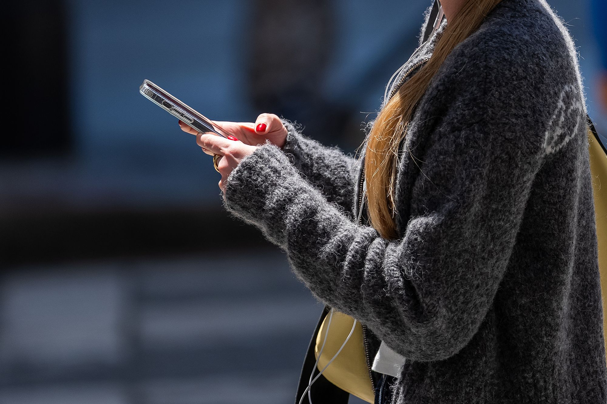 <i>David Paul Morris/Bloomberg/Getty Images via CNN Newsource</i><br/>A pedestrian uses an Apple iPhone in San Francisco on July 28.