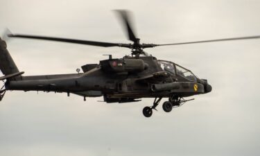 An AH-64 Apache Attack Helicopter in flight during an aviation gunnery exercise on Fort Hood
