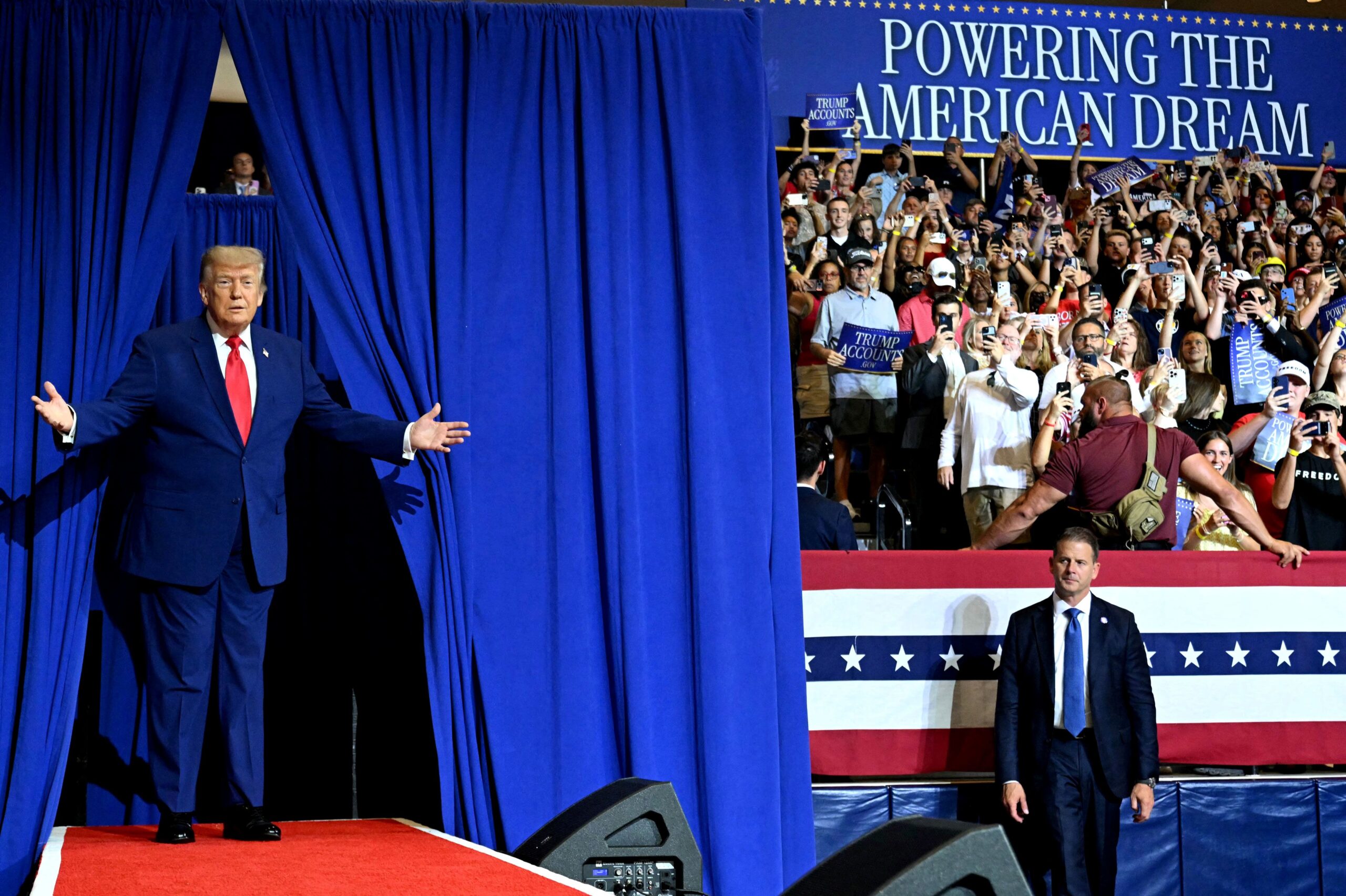 <i>Andrew Harnik/Getty Images via CNN Newsource</i><br/>President Donald Trump greets the audience before speaking at General Motors’ Milford Proving Grounds on July 27