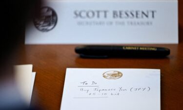 A notepad in front of US Secretary of the Treasury Scott Bessent reads "To Do Buy Japanese Yen $5-10 bil" as he participates in a cabinet meeting at Camp David