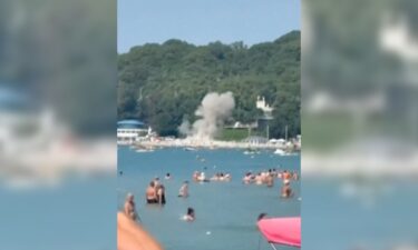 This screenshot from a video shows moment of drone striking Russian beach